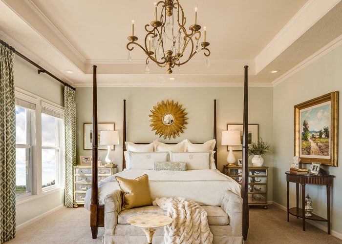 Sunburst-mirror-contributes-to-a-royal-bedroom